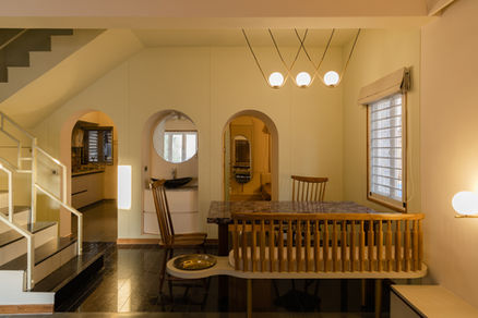 Dining room with table, chairs and pendant lights, interior design, modern style.