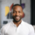Portrait of Arnold, a Semiya branding agency team member, in a modern office setting.