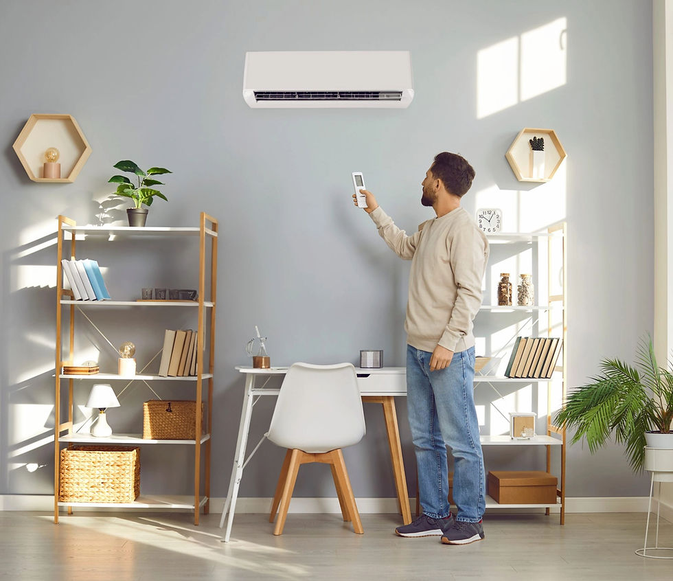 a man using a remote control to operate unit after air conditioning installation London
