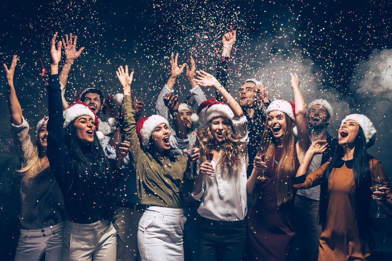 Christmas party with cheering people