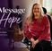 Eve Blackburn, VP of Patient Engagement at ACMCRN, seated at home with the text "A Message of Hope — You're Not Alone. You're Still Here."