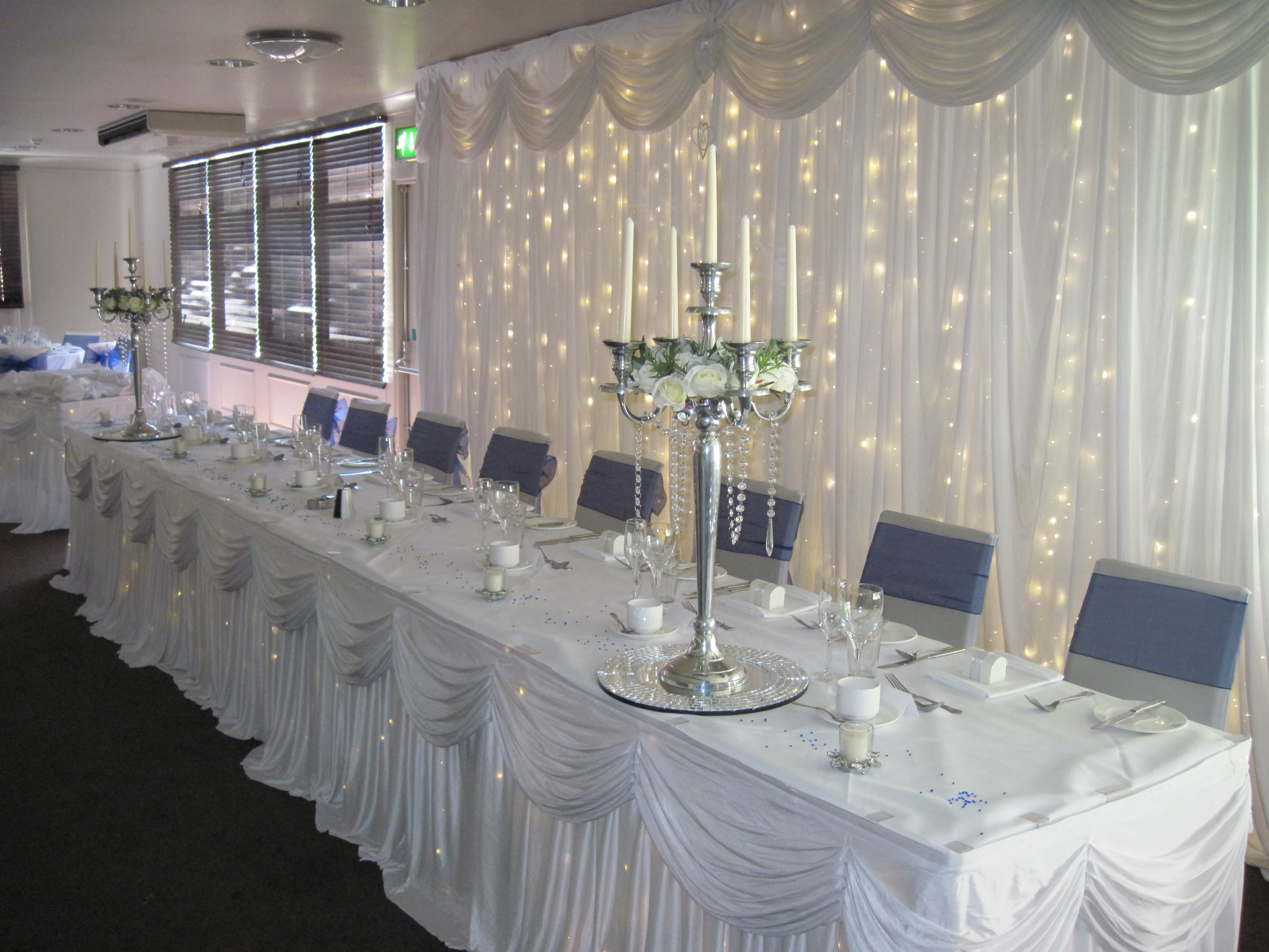 Candelabra with cream rose rings