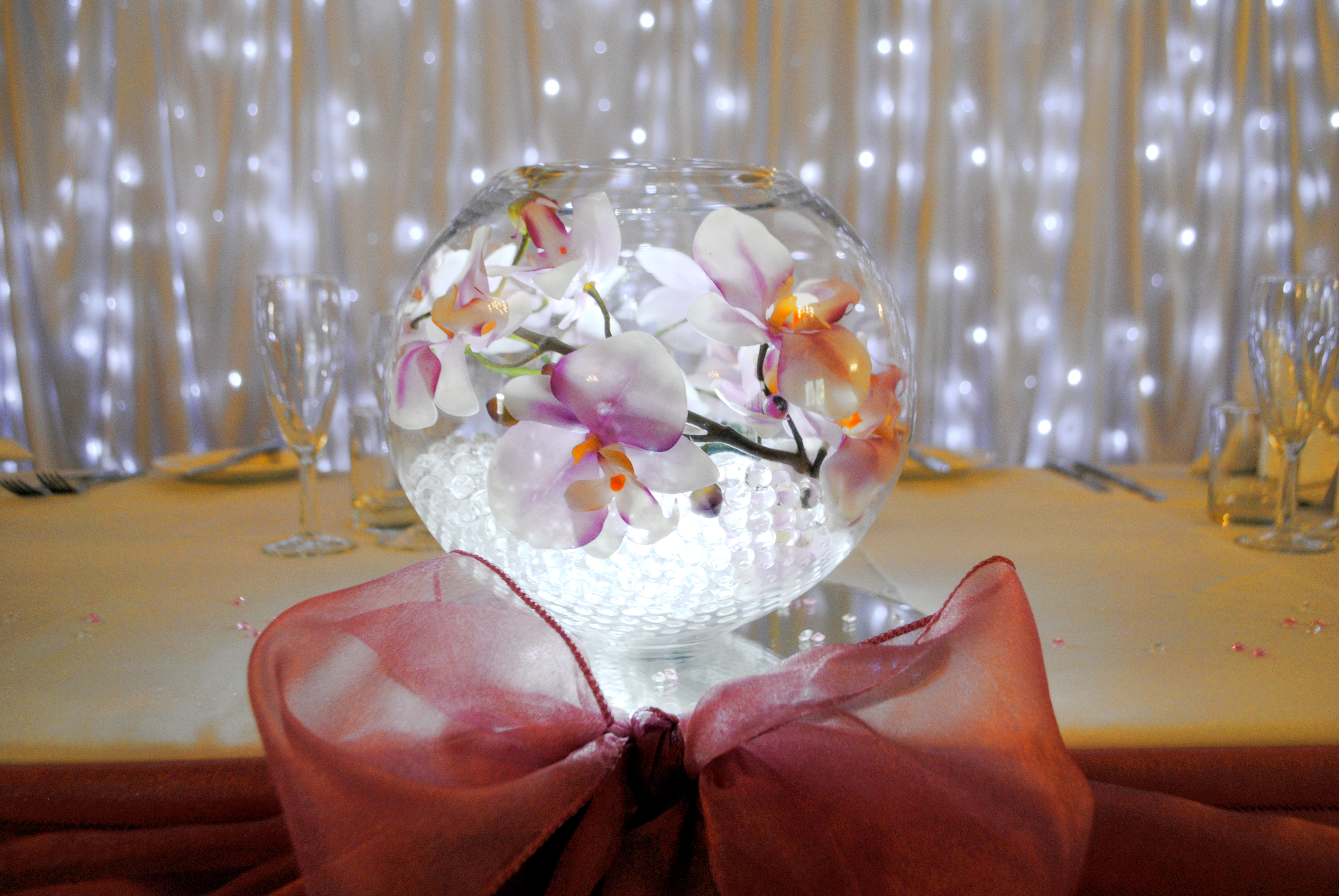 With Artificial Pink Orchids