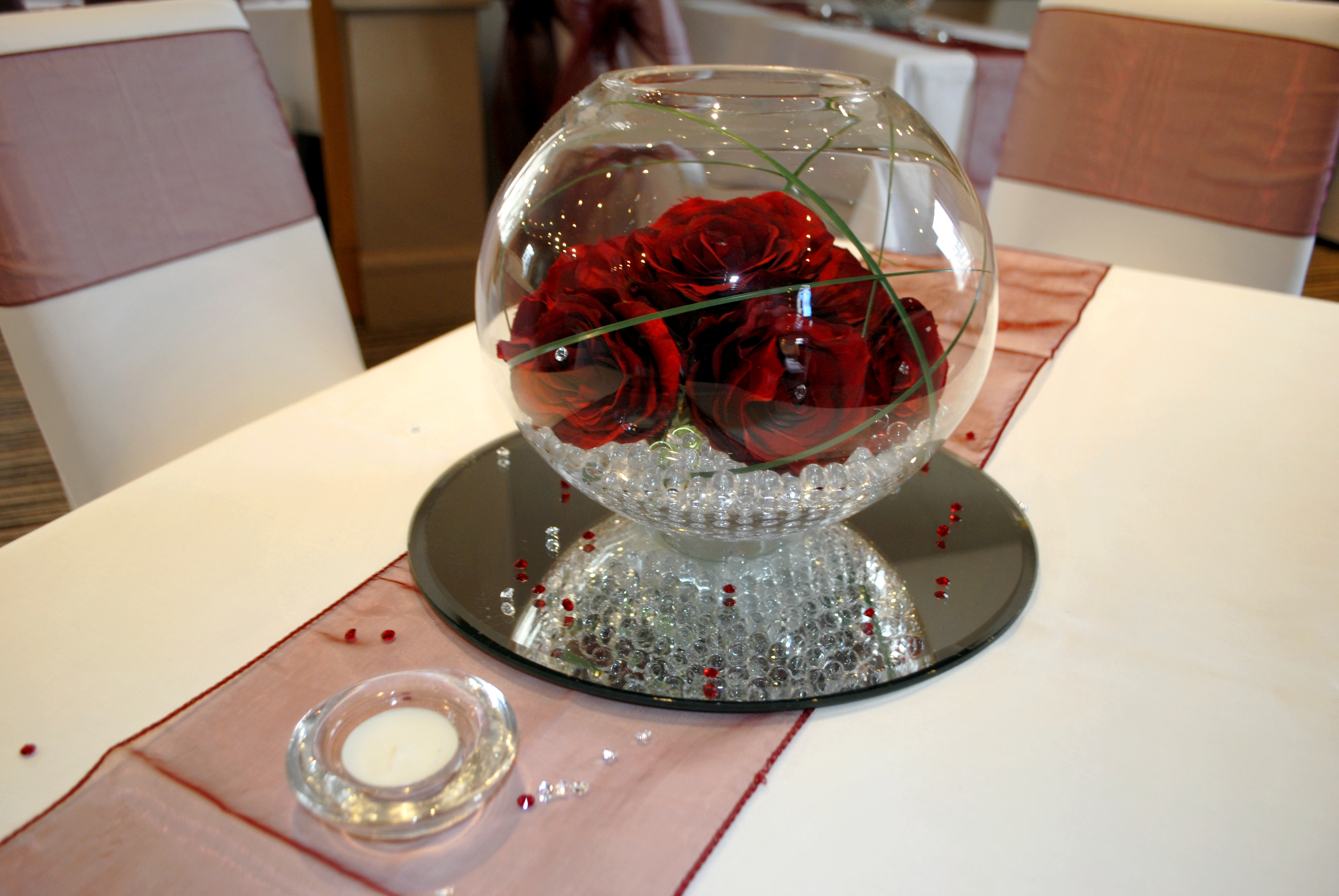 With Artificial Crimson Roses