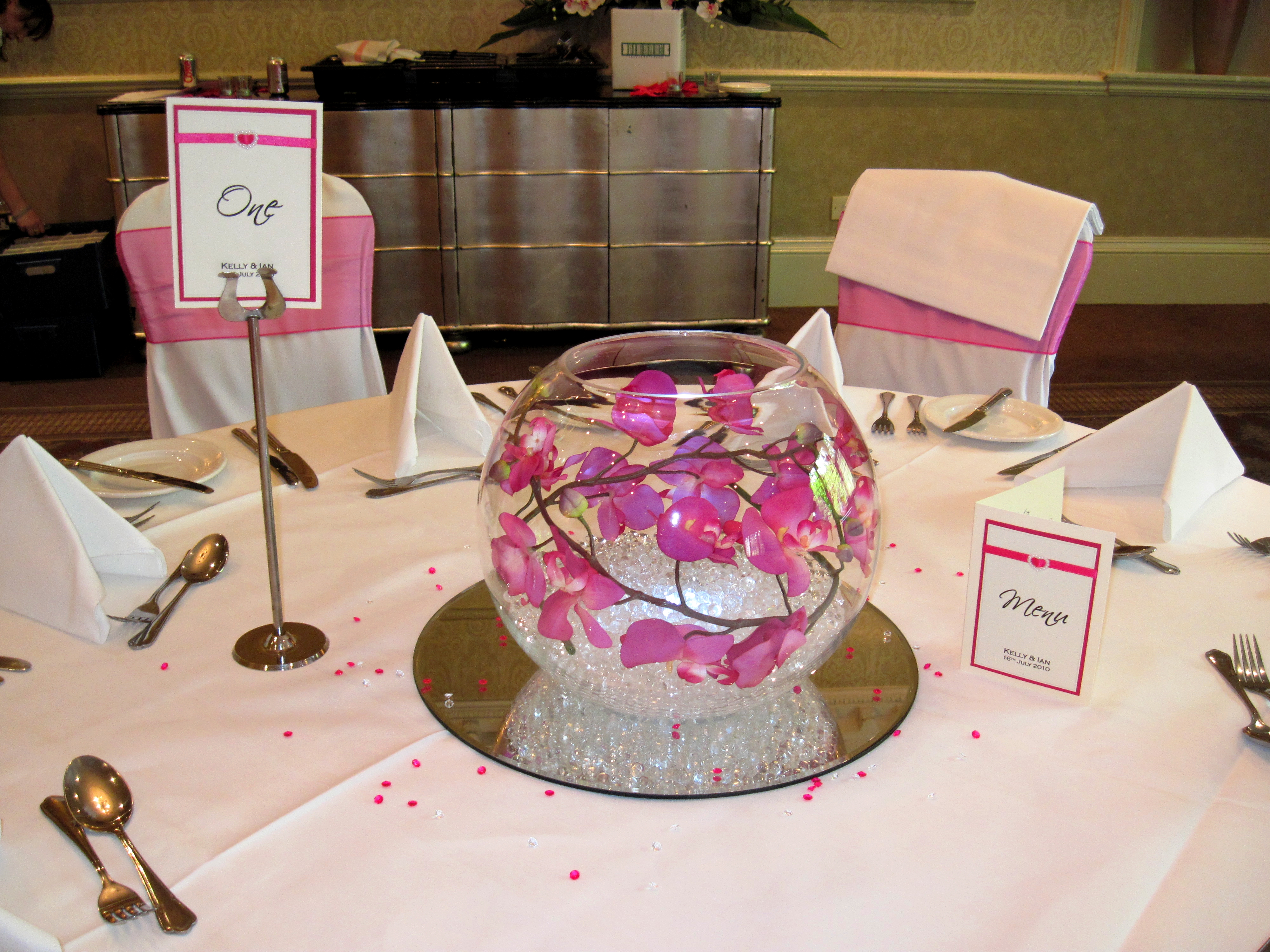 With Artificial Hot Pink Orchids