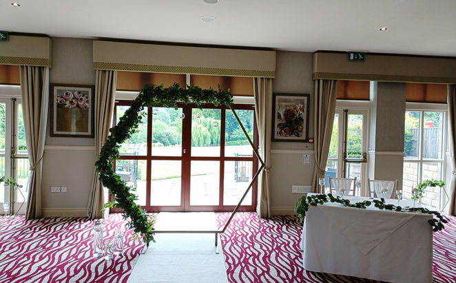 Gold Hexagon Arch With Artificial Greenery