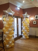 Gold & White Large Balloon Columns With Silver Star Toppers