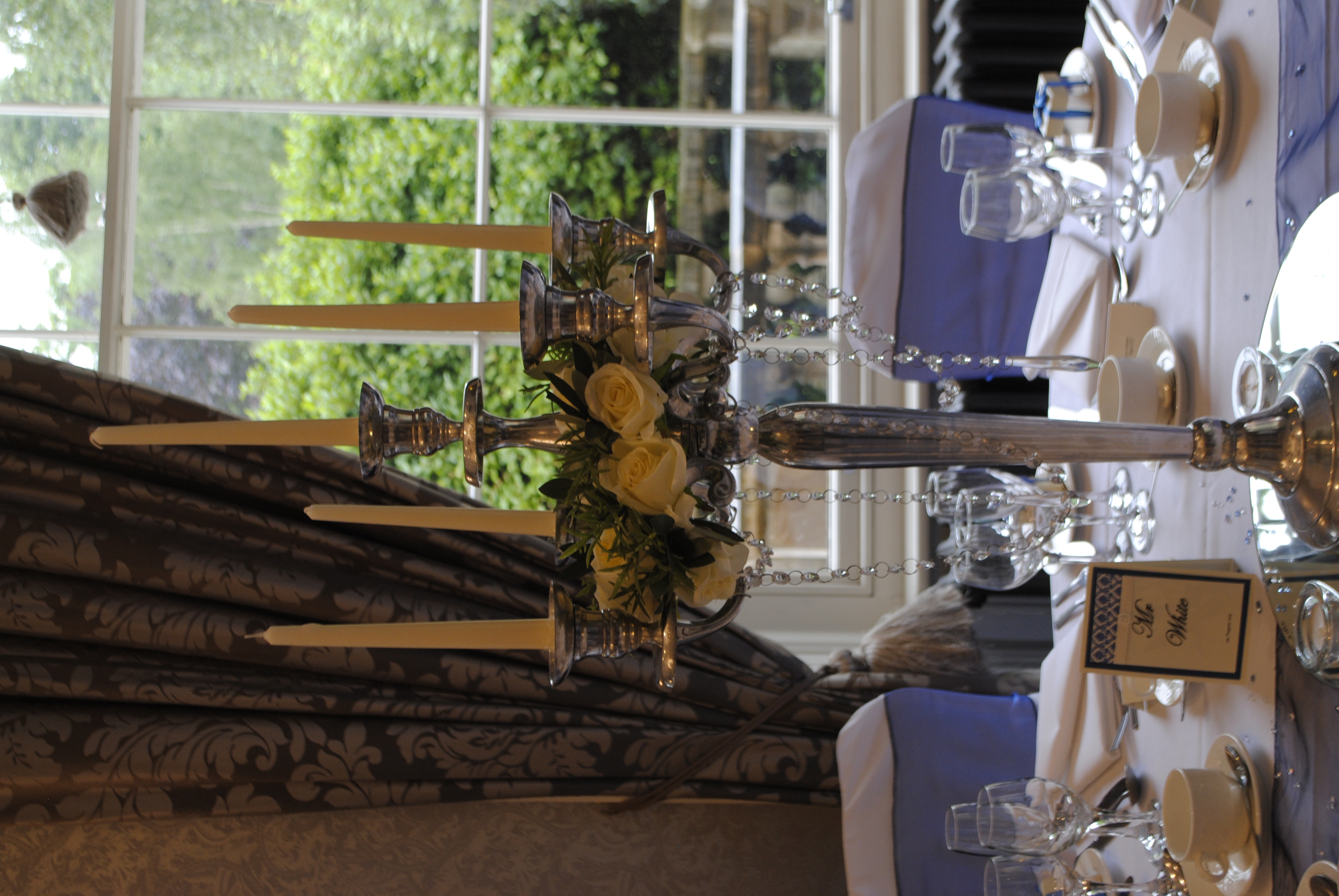 Candelabra with cream rose rings