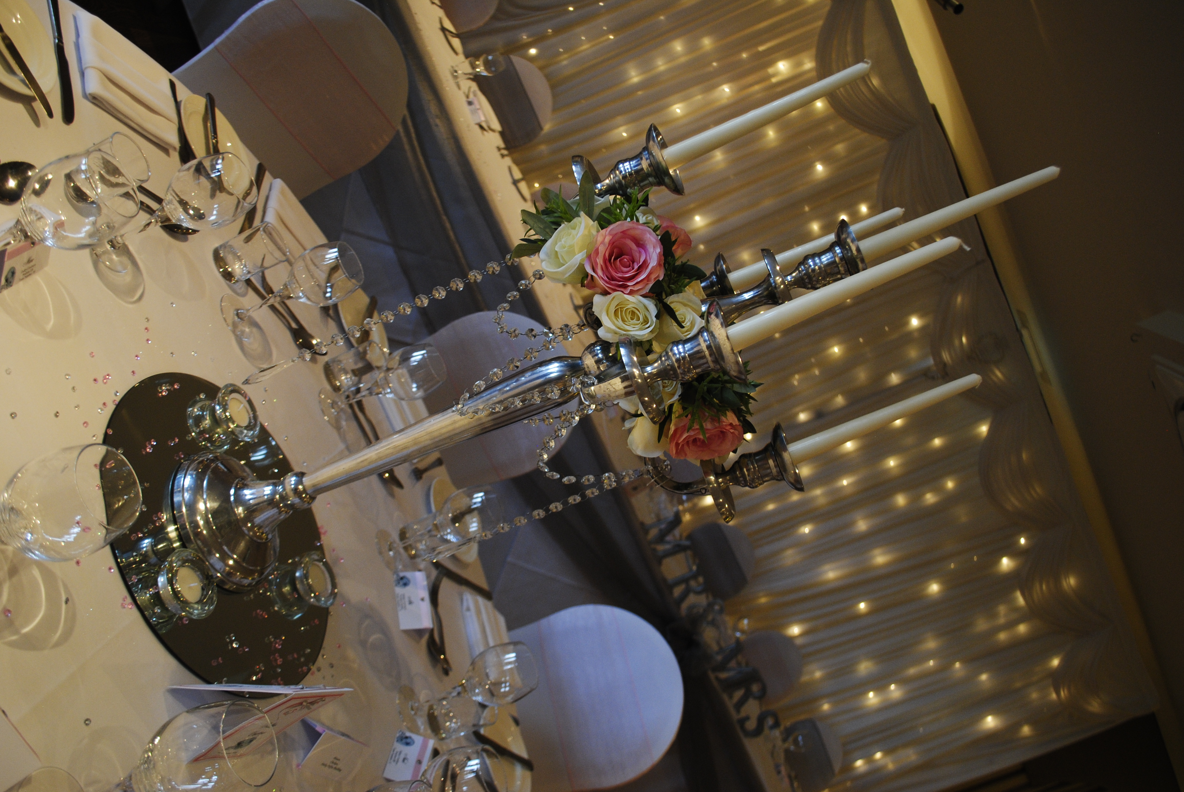 Candelabra with cream rose rings