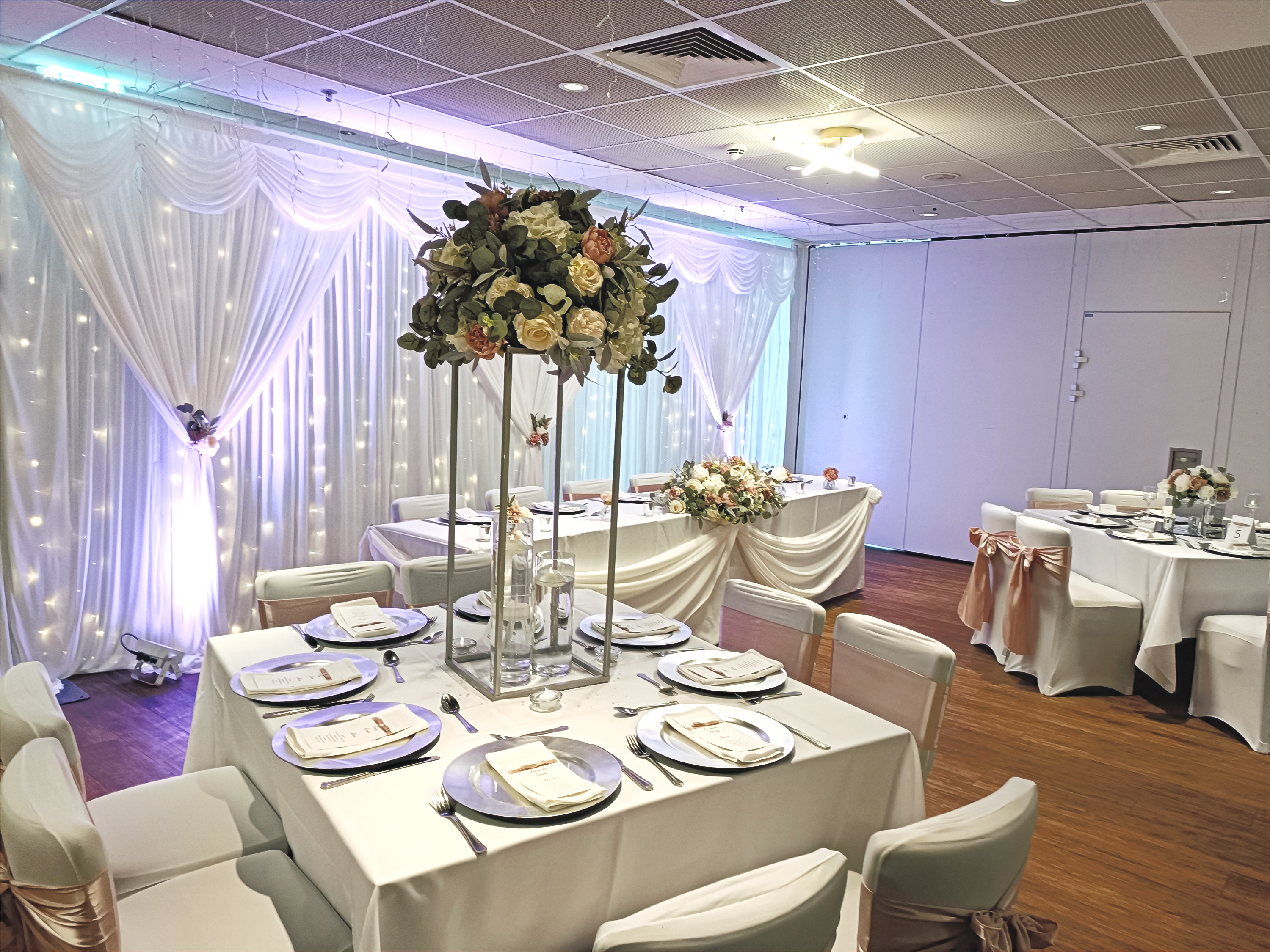 Silver Geometric Stand With Greenery, Ivory & Blush Florals