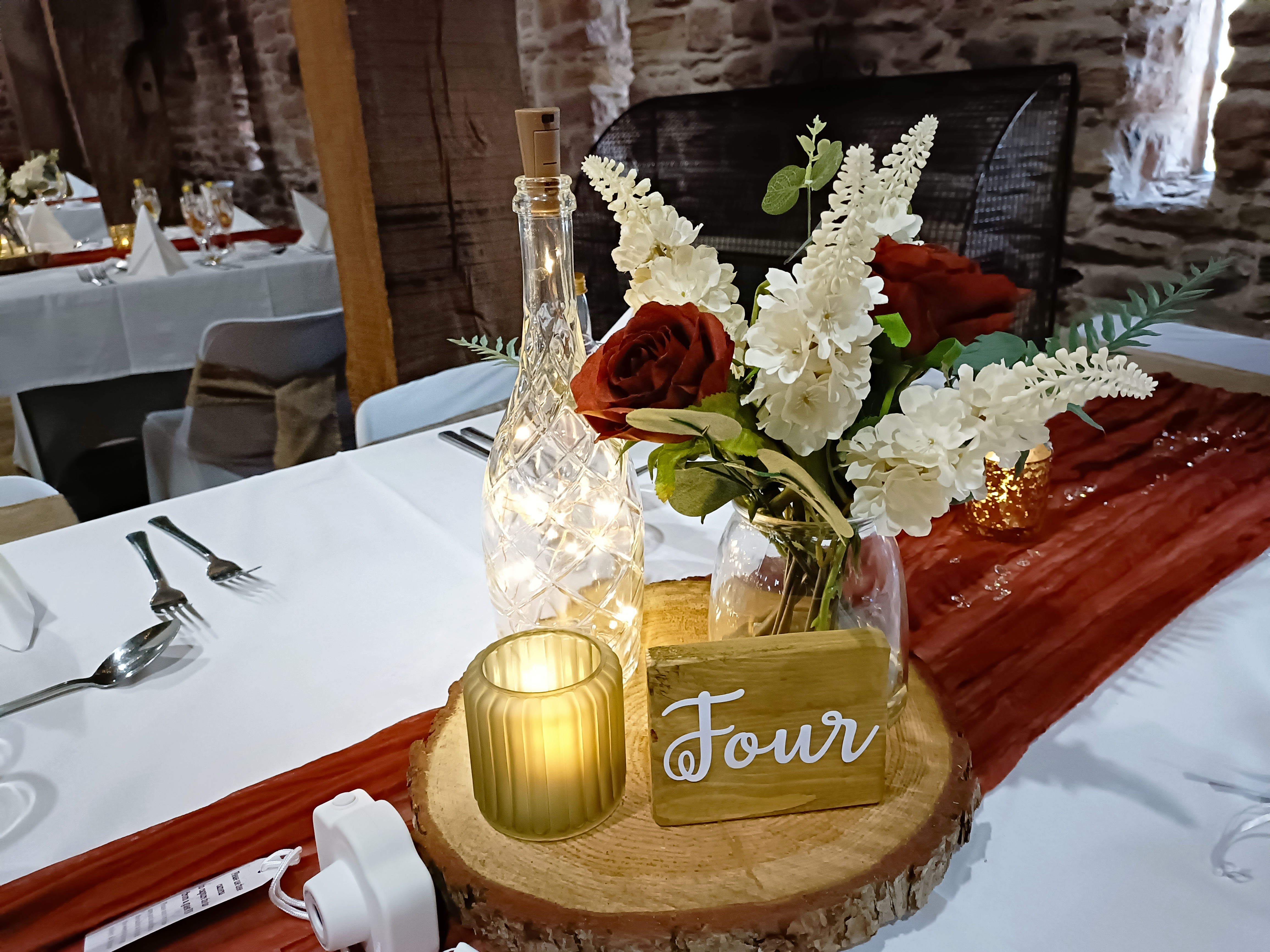 Trio with a single bunch of artificial flowers