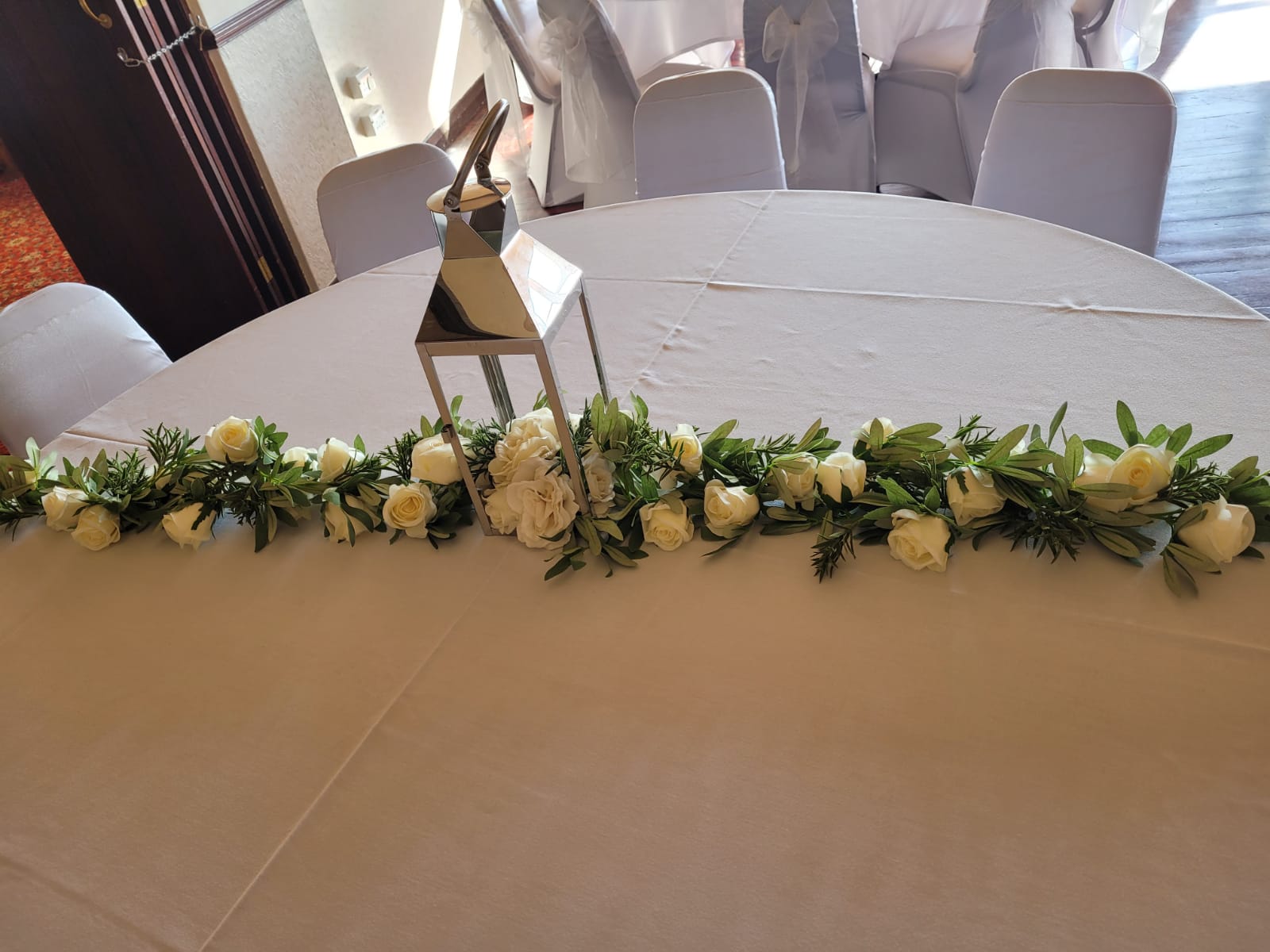 With Cream Roses & Greenery With Additional Cream Rose Garland