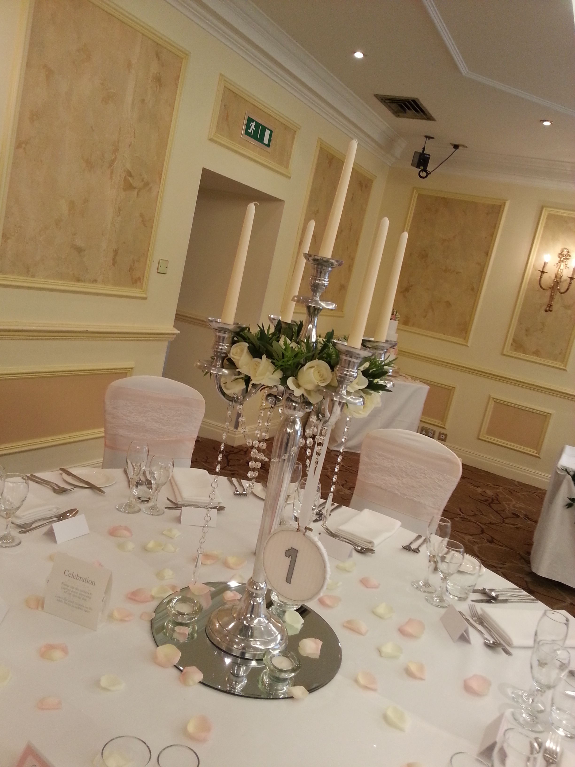 Candelabra with cream rose rings