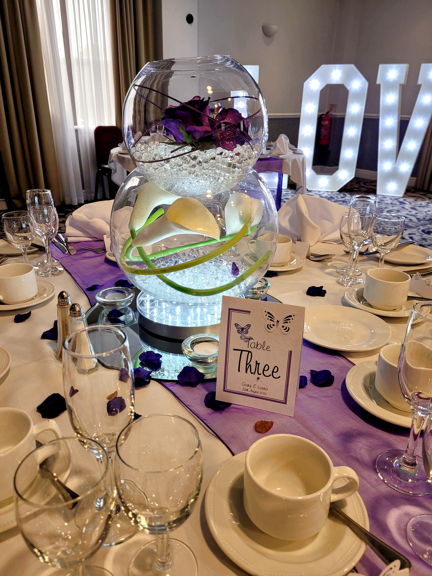 With Artificial Purple Roses & Calla Lily