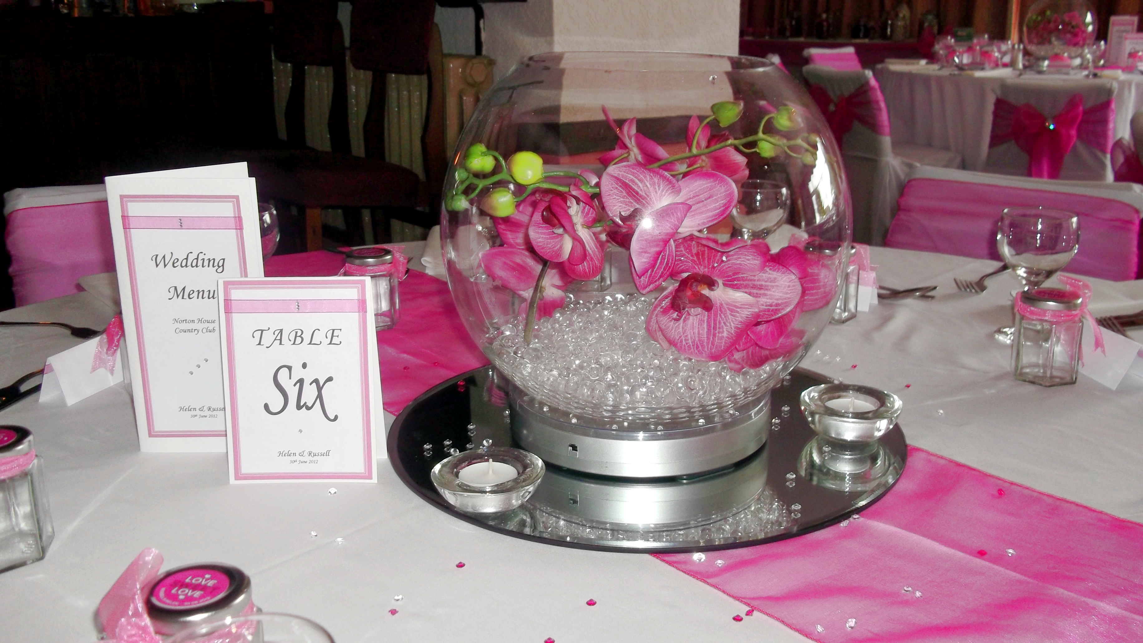 With Artificial Hot Pink Orchids