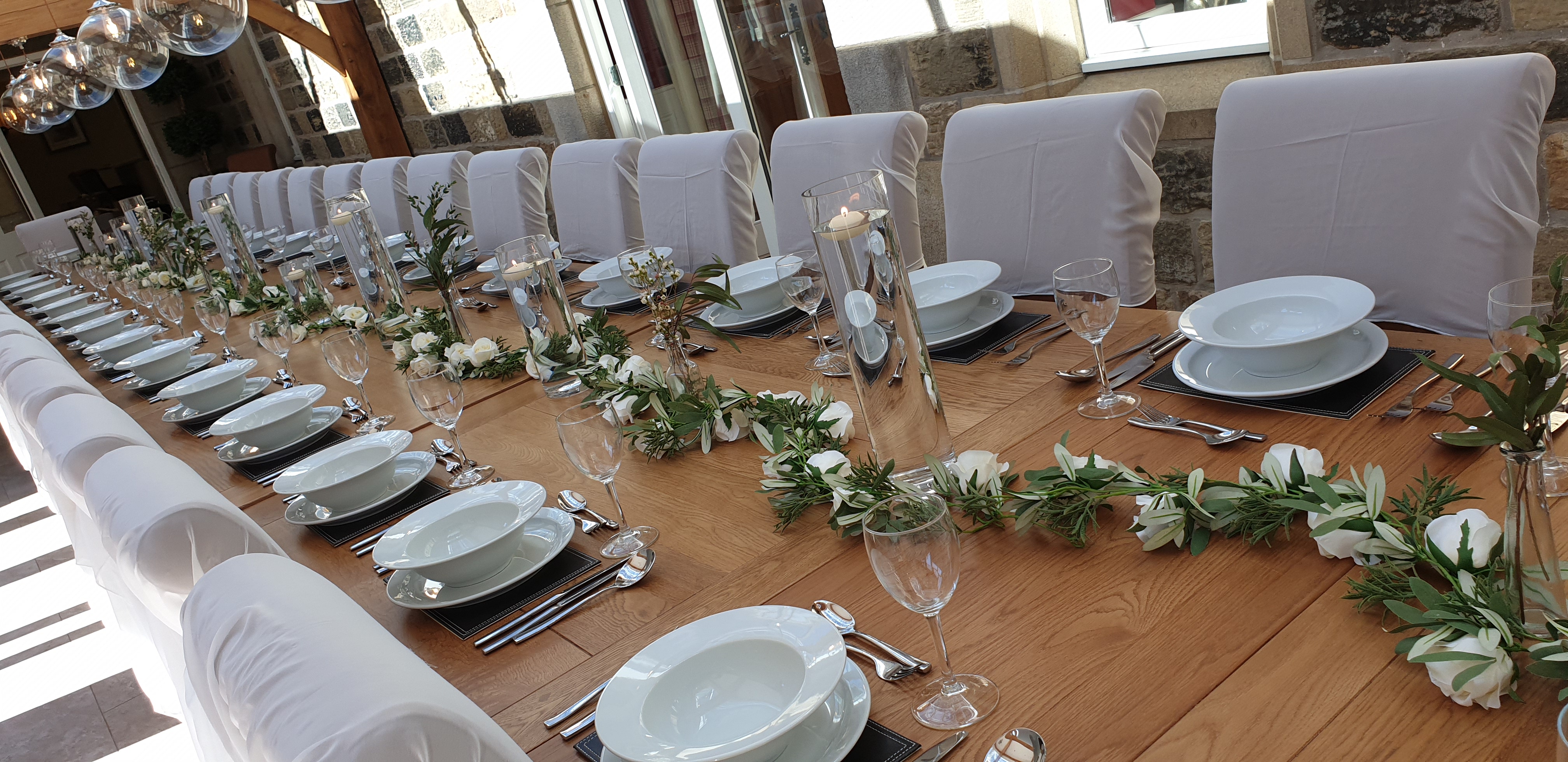 Cylinder Vases With Artificial Cream Rose Garlands