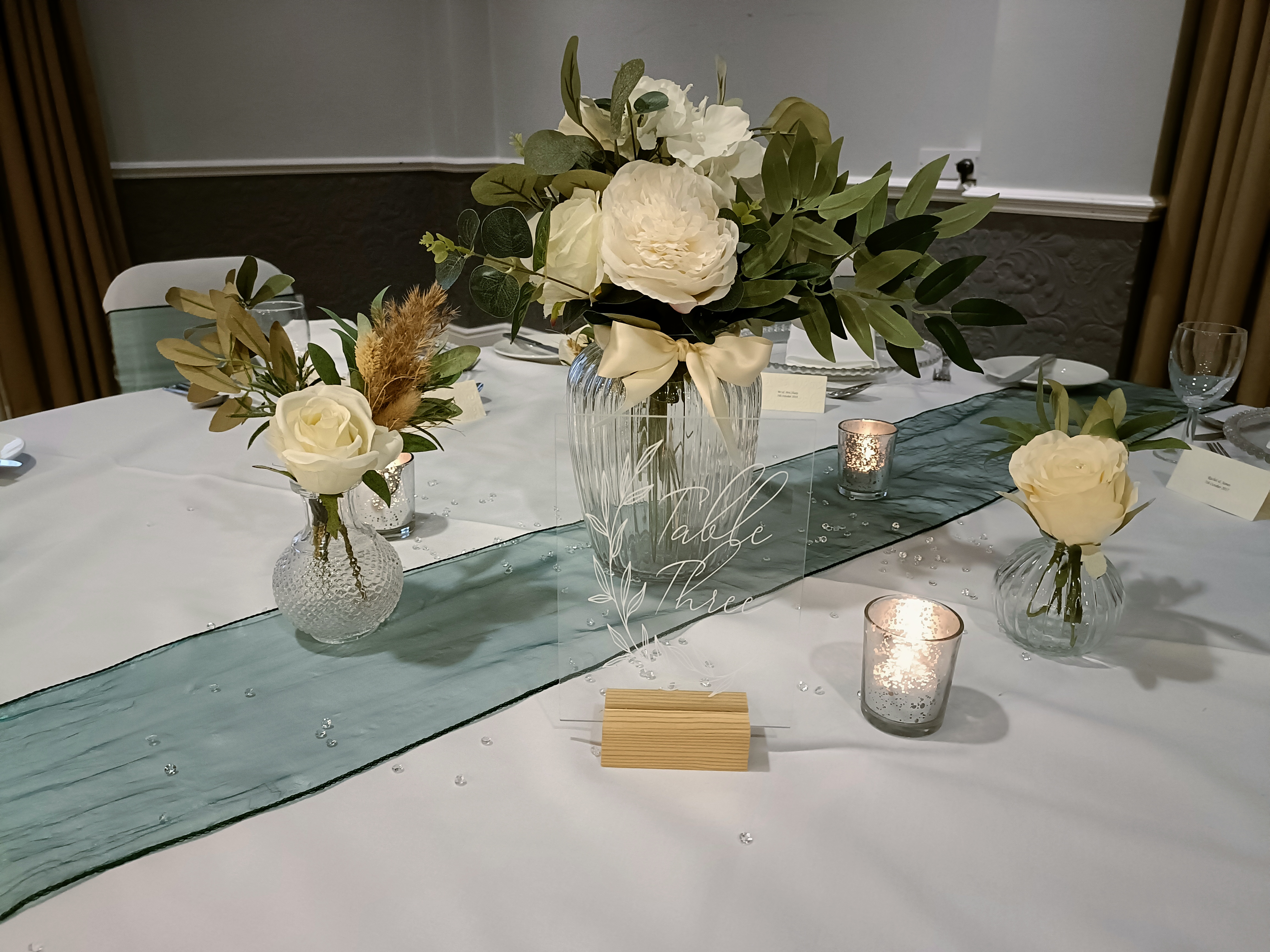 Trio with a 2x bunches of artificial flowers