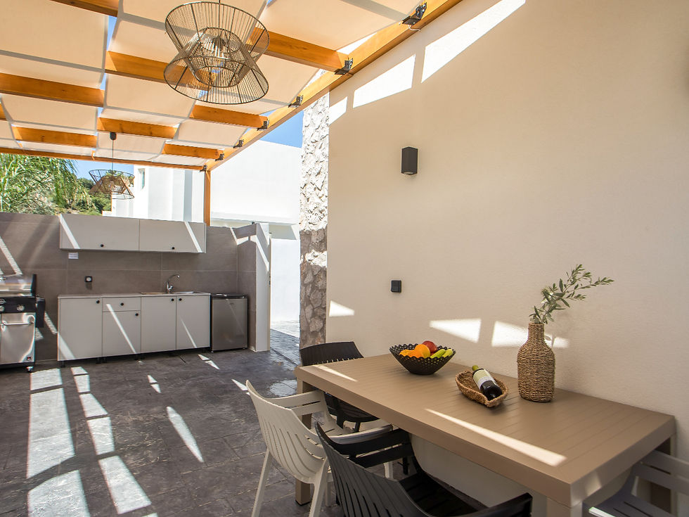 Outdoor kitchen and dining area at a luxury villa in Rhodes