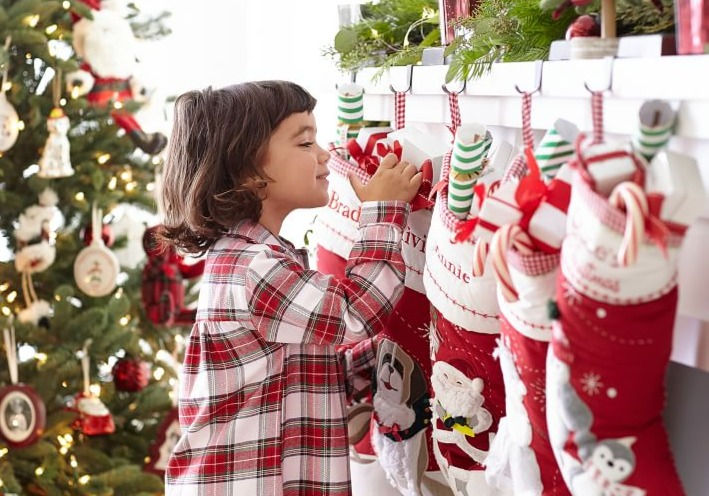 child looking at stocking stuffers
