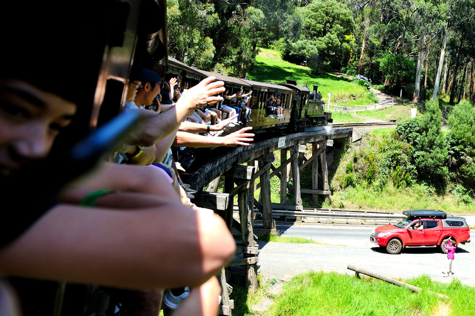 Puffing Billy going over a road bridge