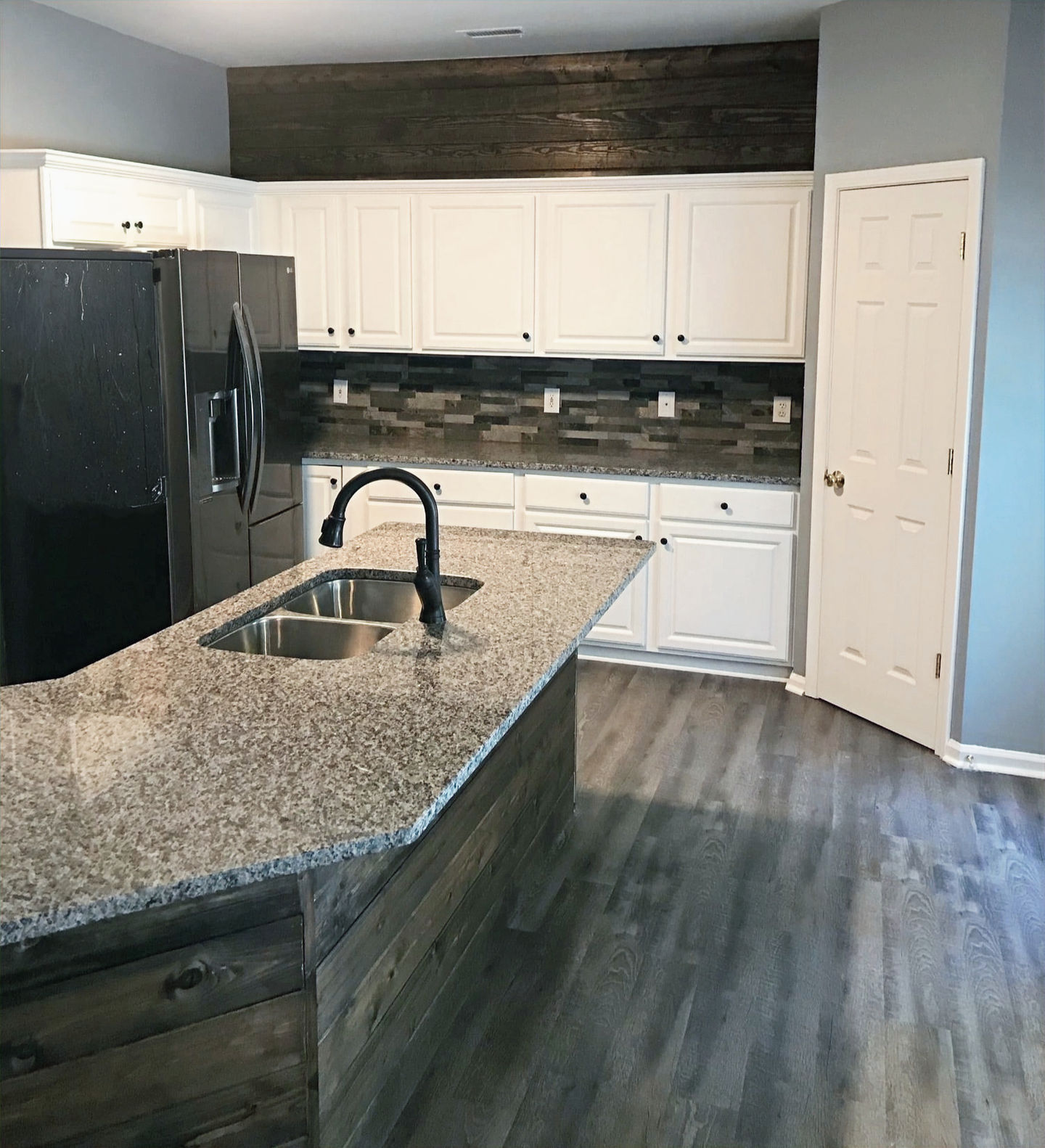 White And Dark Wood Kitchen Remodel by Pyles Construction Services project photo