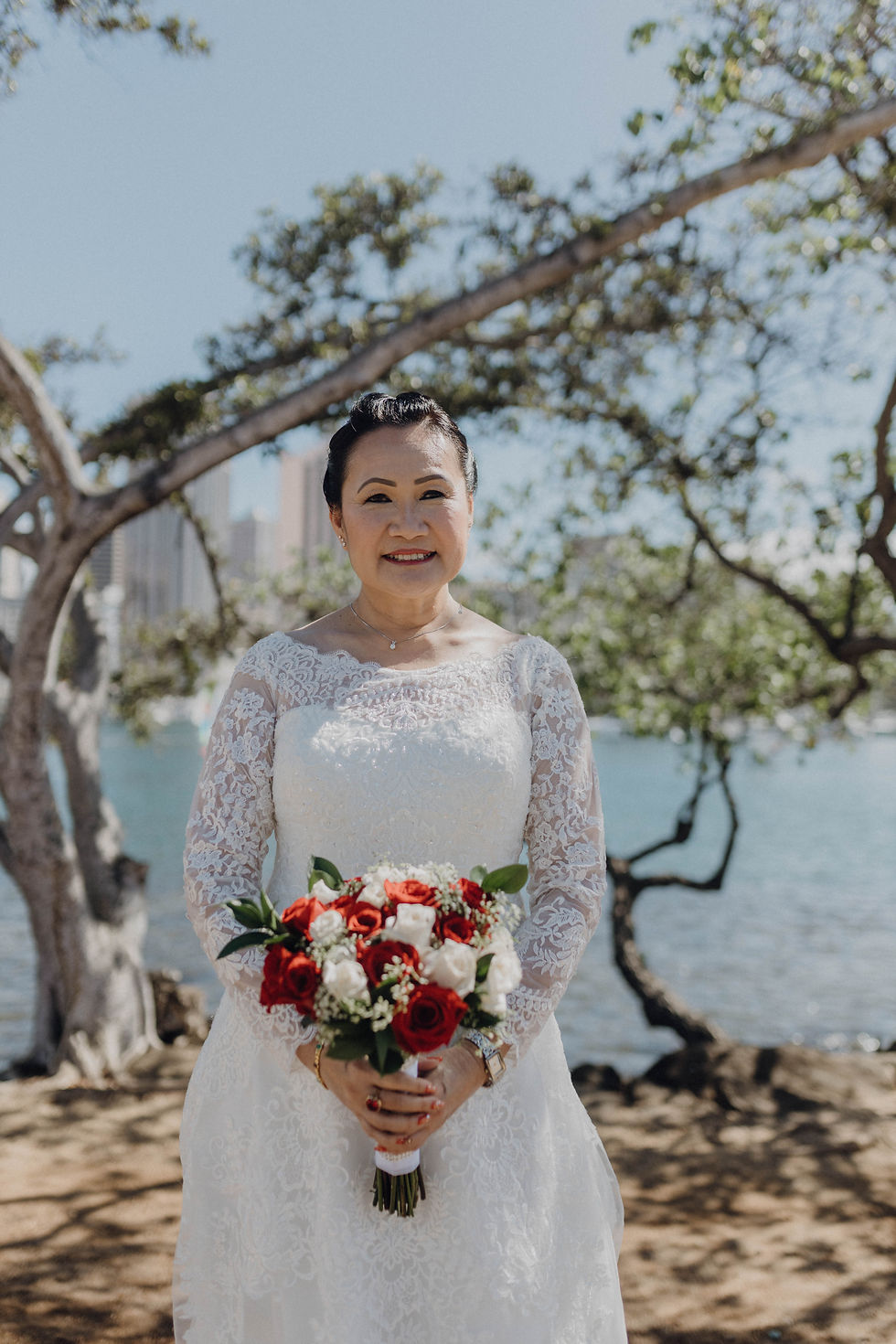 A radiant bride renewing her vows against the breathtaking backdrop of Hawaii's natural beauty, a moment filled with love, joy, and the promise of forever.