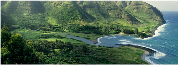 Stunning view of Halawa Valley with lush greenery, waterfalls, and ancient Hawaiian culture.
