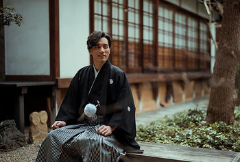 A groom in a formal Japanese kimono, showcasing the elegance of traditional wedding attire. Let us help you create an authentic and memorable day.