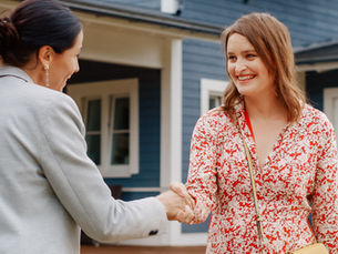 Broker congratulating a couple