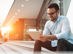Man looking at his tablet