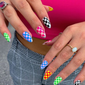 Bright checkerboard nail art in rainbow colors – bold statement nails in Naples, FL