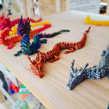 A collection of custom-designed 3D-printed accessories, including colorful Jibbitz charms and fidget toys, exemplifying Teale Accessories' unique and playful product offerings.