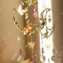 Decorative hanging floral wreath with butterflies and soft natural light creating a calm, artistic interior scene