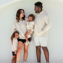 Unisex Logo Hoodie in banana crepe colour featuring the FAMBAM CO logo, soft cotton-polyester fleece pullover with a relaxed fit, perfect for casual wear and lounging.