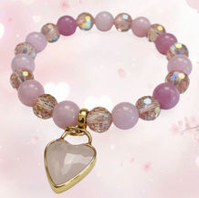 Jewelry brand featuring handcrafted gemstone bracelets with decorative charms for everyday fashion and special occasions.