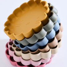 A collection of eco-friendly silicone baby utensils and teething toys from KXE Baby Boutique.