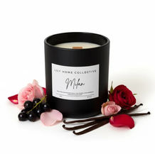 Milan scented candle in a minimalist glass jar with creamy white wax and wood wick, styled on a neutral background to highlight its clean, elegant design.