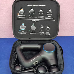 Theragun Prime Plus massage gun in a carrying case.