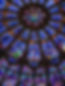 A close up photo of a stained glass window from a church.