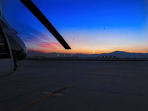 Aircraft at sunset on remote airfield runway