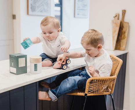 Arthur and Fred, Tiffany's children, playing with toys around the non-spill, child-safe diffuser