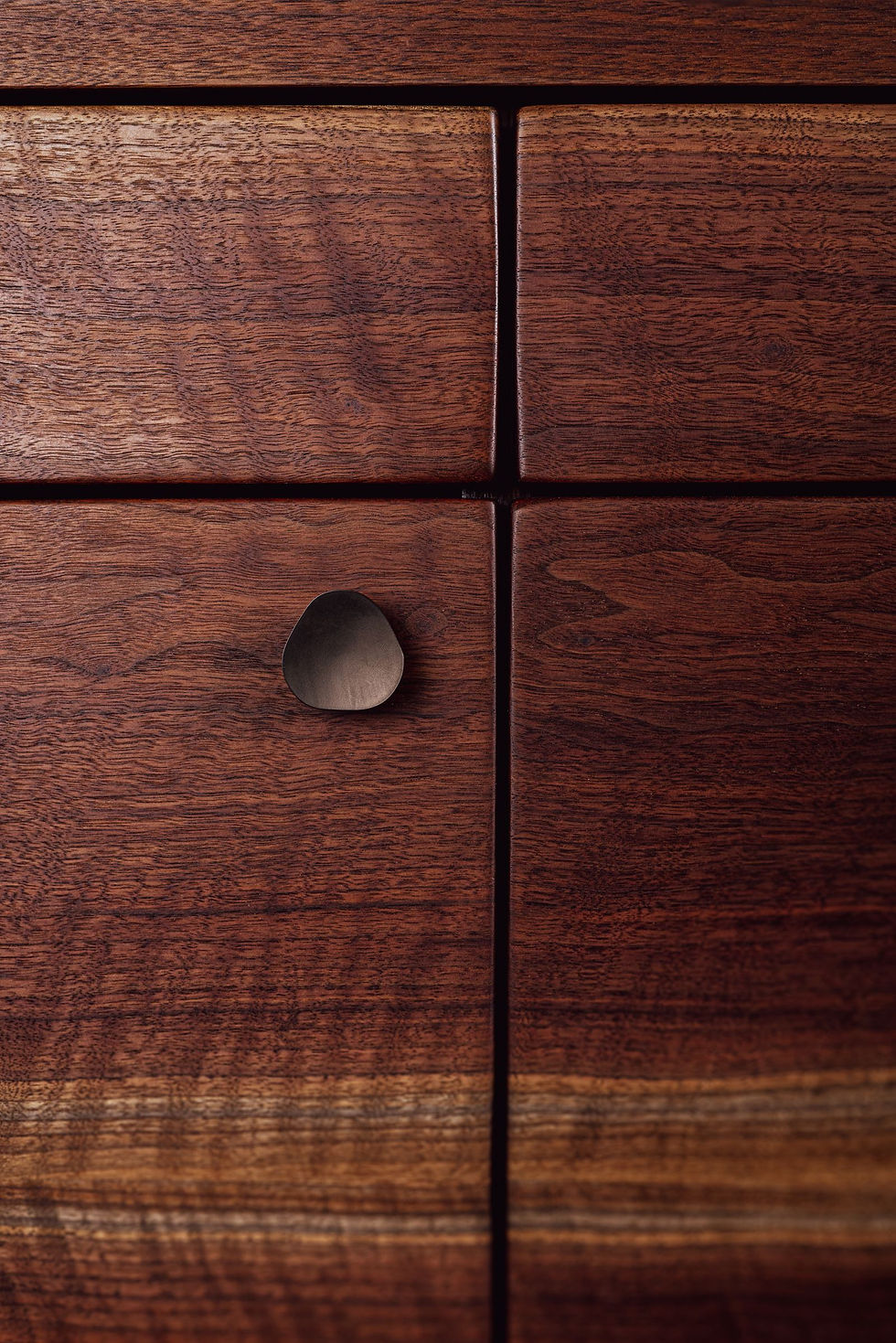 Closeup of the custom sideboard showing Plank Hardware's "Pebble" design.