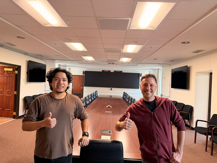 The Sound Designs team with the finished conference table at Fort Knox.