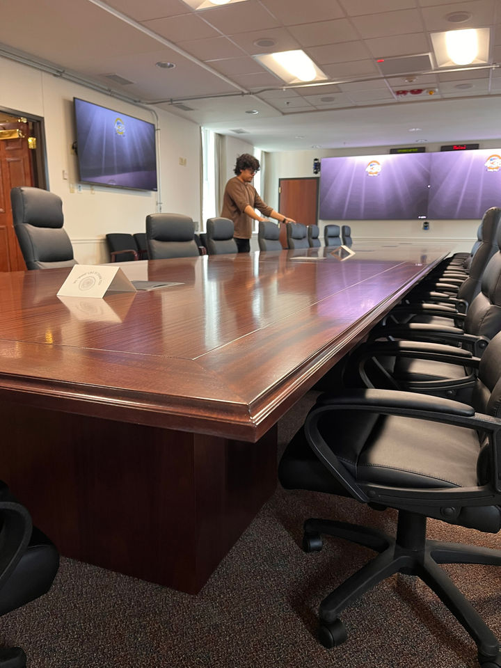 Corner of the Khaya mahogany conference table with the chairs set up at Fort Knox.