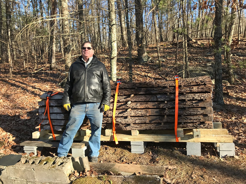 Joe Falco with the finished stack of Sea Cliff walnut slabs