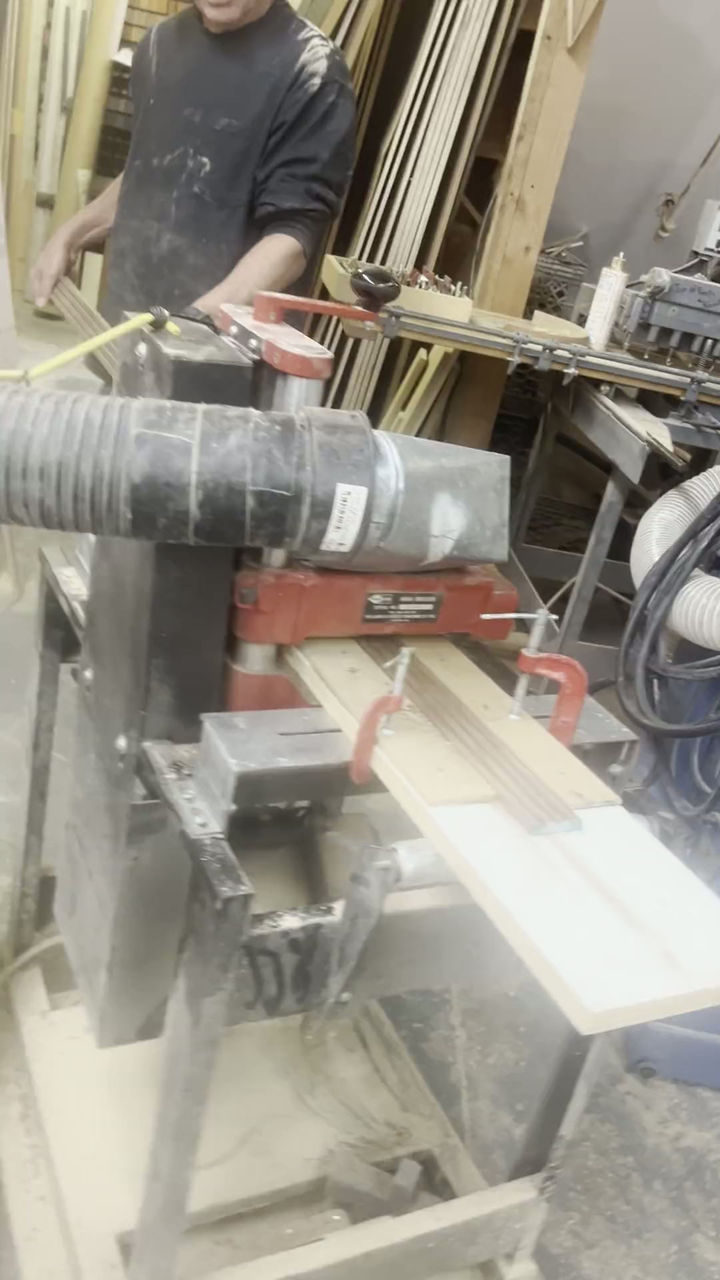 Joel Landstein running the tambour strips on the molding machine in our shop on Pratt Oval, Glen Cove.