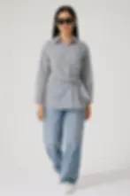 Woman wearing The Pinstripe long sleeve semi formal Knot Shirt with jeans Skynn