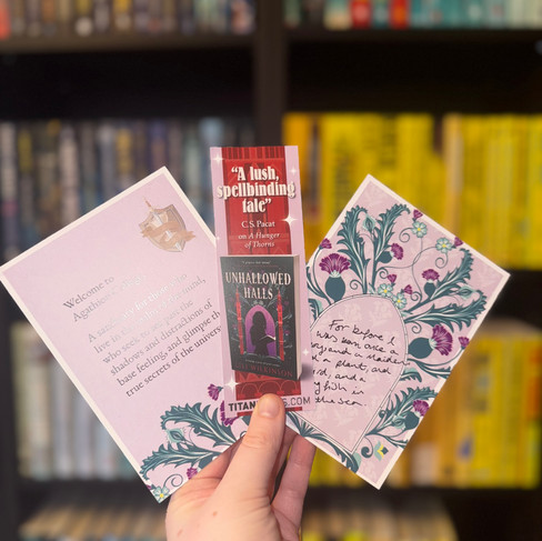 A hand holding promotional material. 
