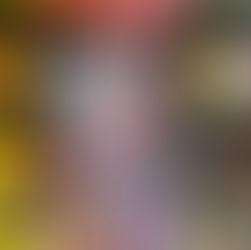 Hand holding a book titled "Spirits Abroad" by Zen Cho, featuring a red dragon on the cover. Background shows colorful, blurred bookshelves.