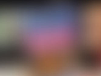 Hand holds a book titled "Christmas at the French Repair Shop" by Sophie Claire. Cozy festive illustration. Bookshelves in the blurry background.